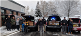 PD Officers and civilian staff preparing to deliver 70+ turkeys and food to needy families across th
