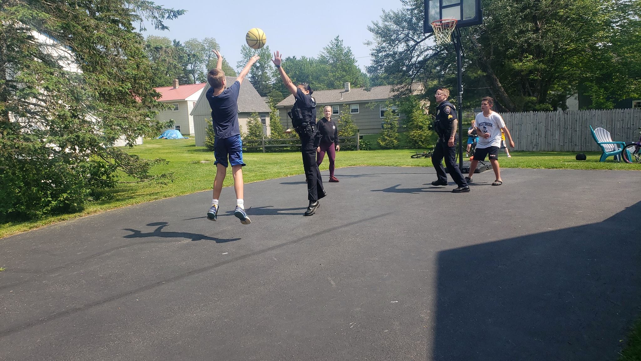 Officers playing basketball